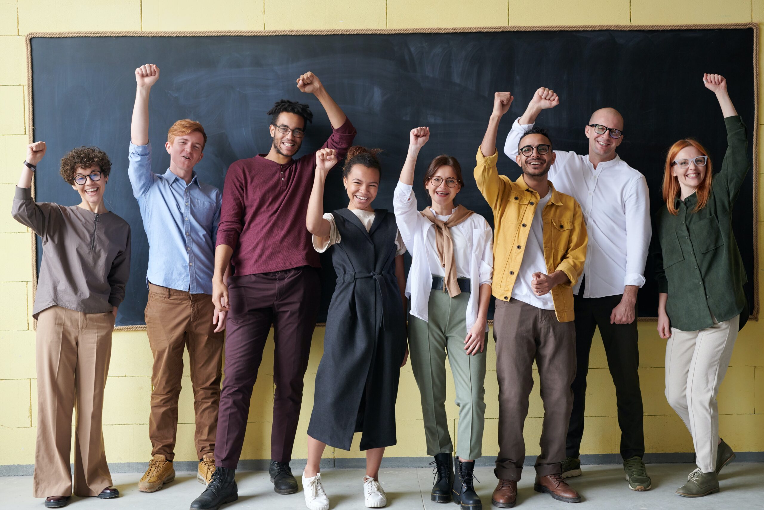 Lead Generation_ Picture of group of people with one hand raised